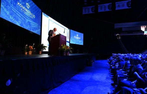 A man stands at a podium.